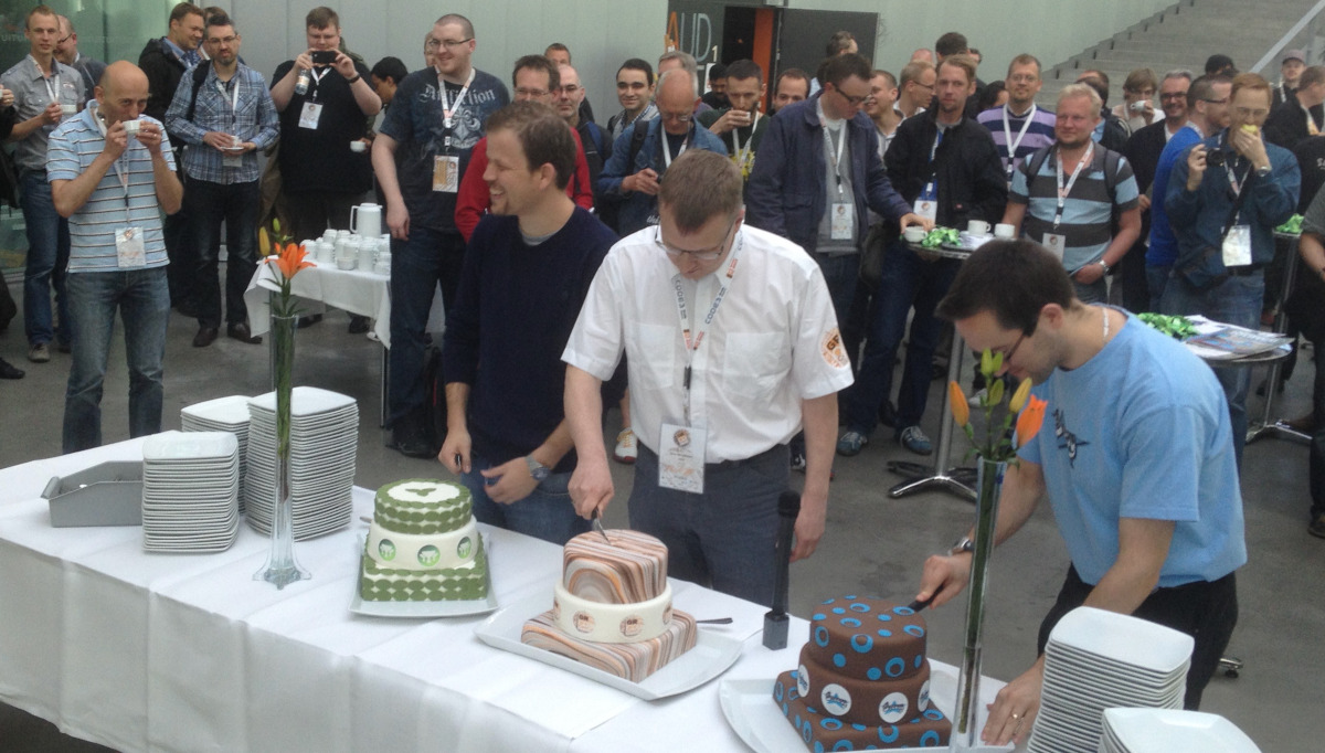 Graeme Rocher, Søren Berg Glasius and  Guillaume Laforge with the anniversary cakes for Grails, GR8Conf and Groovy