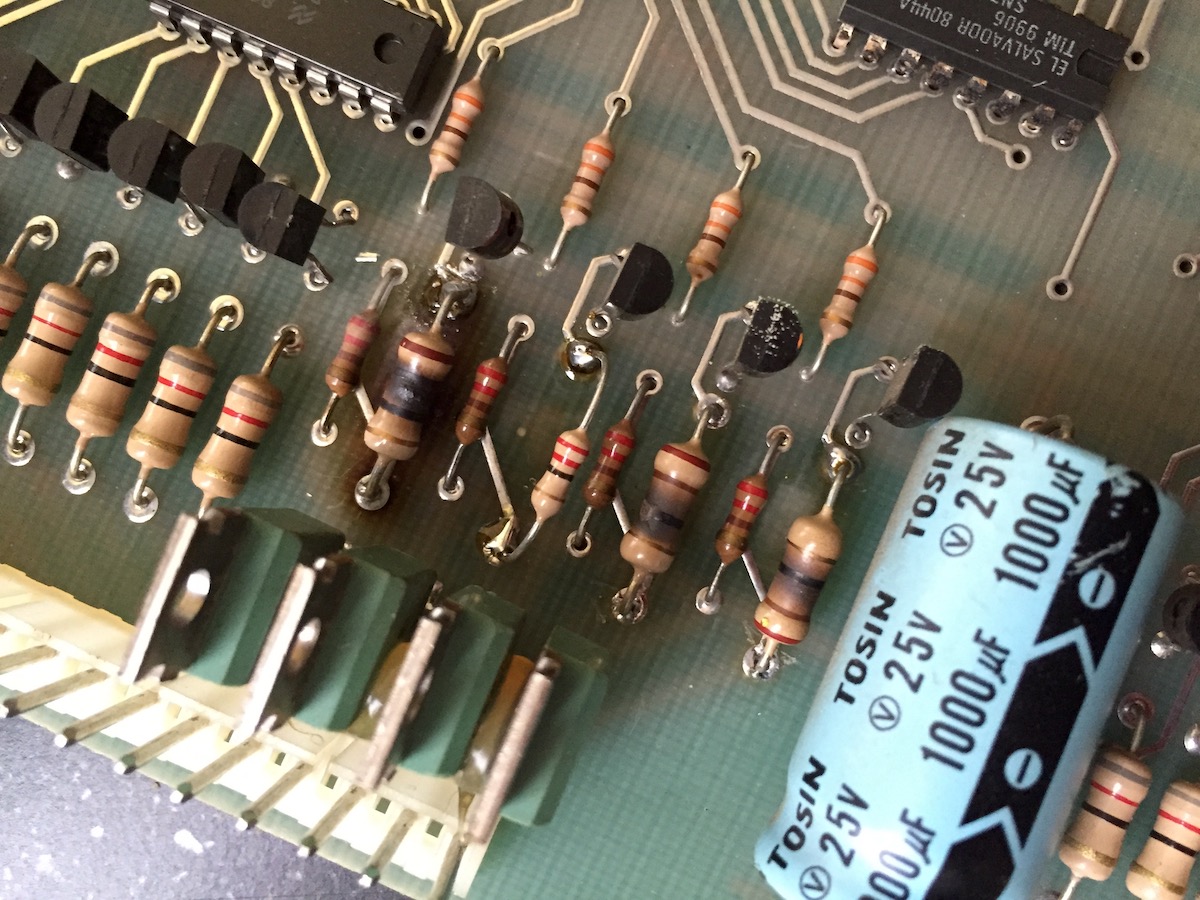 A couple of clearly burned resistors might have been a culprit for retering this machine